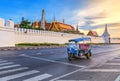 Thai Tuk Tuk and the Grand Palace Royalty Free Stock Photo