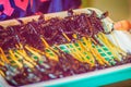 Thai vendor is selling roasted scorpion on street in Bangkok night market, Thailand.
