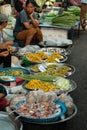 Thai vendors sell flowers used for cooking in a morning market in Thailand.