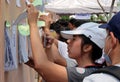 Thai voters check their name list during the advance voted.