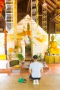 Thai Wat Pra That Pukhao, Chiang Rai, Thailand, May 31 2015: Undefined man praying in Wat Pra That Pukhao temple near Royalty Free Stock Photo