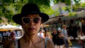 Thai woman with black hat and sunglasses Royalty Free Stock Photo