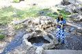 Thai woman cooking boiling eggs in hot spring of Pa Tueng Hot Spring in Chiang Rai, Thailand