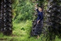 Thai woman in the countryside traditional costume portrait under the sugar palm trees row, thailand Royalty Free Stock Photo