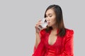 Thai Woman drinking a glass of water