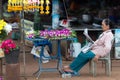 Thai woman flowers seller