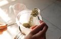 Thai woman making a milk green tea using tea filter bag. Royalty Free Stock Photo