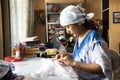 Thai woman people fold bundle and sewing or arashi shibori on fabric