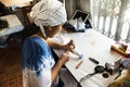 Thai woman people fold bundle and sewing or arashi shibori on fabric