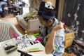 Thai woman people painting natural color indigo on fabric on table