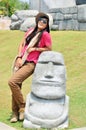 Thai woman portrait with Moai Easter figure