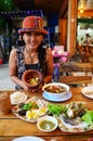 Thai woman portrait with Thai Cuisine Set Royalty Free Stock Photo