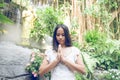 Thai woman praying in a buddhist temple Royalty Free Stock Photo