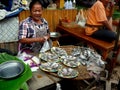 Thai Woman Selling Fish at Early Morning Market