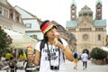 Thai woman show ice cream and eating on the road at Speyer town