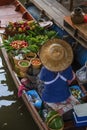 Thai woman selling food on boat at floating market in Thailand Royalty Free Stock Photo