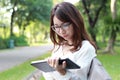 Thai woman student university beautiful girl using her tablet.