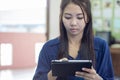 Thai woman using tablet Royalty Free Stock Photo