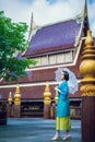 Thai woman wearing typical Thailand traditional dress at house (