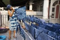 Thai women working Indigenous knowledge of thailand tie batik dyeing indigo color at outdoor on top of house at Thailand Royalty Free Stock Photo