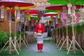 Thai women dressed in Thai Lanna costumes Walking in front of important tourist sites in Nan province, Thailand