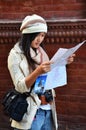 Thai women people travelers looking reading map guide book journey travel and walking on street visit take photo local life