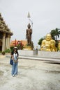Thai women people visit and respect praying Wat Sakae Krang at Uthai Thani, Thailand