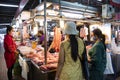 Thai women people wear mask select buying products food and pork chicken beef from vendors grocery stall at fresh local market on