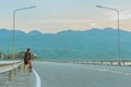 Thai women ride bicycle for exercise in the evening after sunset