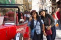 Thai women take photo with red retro car at old town near Charles Bridge Royalty Free Stock Photo