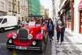 Thai women take photo with red retro car at old town near Charles Bridge Royalty Free Stock Photo