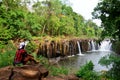 Thai women travel and posing for portrait at Tad Pha Suam waterfall