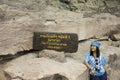 Thai women travel and posing at Rock art on cliffs at Pha Taem National Park in Ubon Ratchathani, Thailand Royalty Free Stock Photo