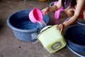 Thai women washing and clean clothes after tie batik dyeing natural color Royalty Free Stock Photo