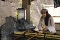 Thai women washing hand rite or Mitarashi ritual with Chozusha or Holy water at Naritasan Shinshoji or Narita Temple Royalty Free Stock Photo