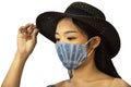Thai women wear handmade indigo fabric mask with hat and posing portrait for take photo at studio while Coronavirus COVID 19