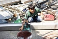 Thai workers people working made and build and manual welding structure of awning roof at front of house at construction site on Royalty Free Stock Photo