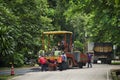 Thai workers working with heavy machinery construction site repair surface of road