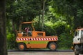 Thai workers working with heavy machinery construction site repair surface of road