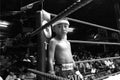 Thai young boxer stand on boxing ring