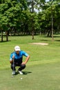 Thai young golf player in action among practice time before enter in golf tournament at Chiang rai ,Thailand