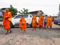 Thai Young Monk in the Local Village. Buddhist Donation Event in