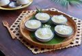 Steamed Cassava cake top with coconut at close upview - Thai dessert called Kamon Mun