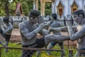 Statues of fighters of the ancient Thai martial art Muay Boran in the temple of Bang Kung Camp