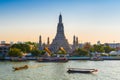 THAILAND, BANGKOK - APRIL 12, 2018: Early evening, the tourist boats sail along the Chaopraya River near the Wat Arun. Royalty Free Stock Photo