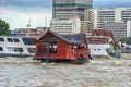 Traditional wooden boat with restaurant on the Chao Phraya river Royalty Free Stock Photo