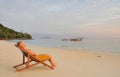 Thailand.Beautiful girl relaxing on deserted beach