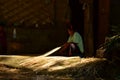 A womand weaving a baskets from wickers, Thailand Royalty Free Stock Photo