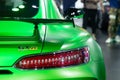 Thailand - Dec , 2018: Mercedes benz AMG GTR series green color luxury sport car in motor show . rear view car close up taillight