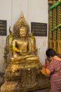 Thailand elderly woman respect buddha at Wat Tha Luang Temple, P